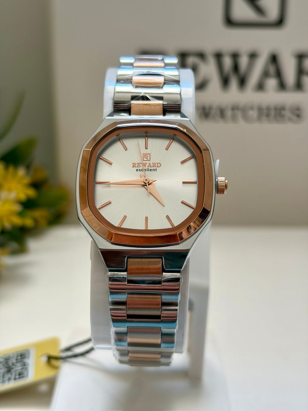 Reward Watches Facette Rosée women's watch with octagonal case, silver stainless steel, rose gold bezel, white dial, and bicolour bracelet.